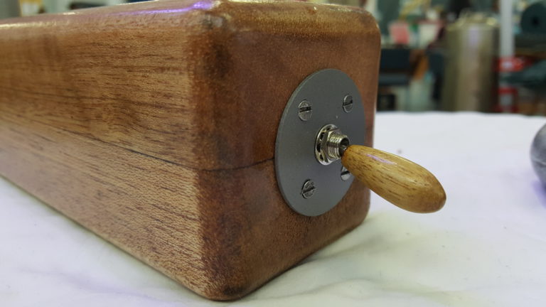 Custom switch detail of steam-curved wood lamps